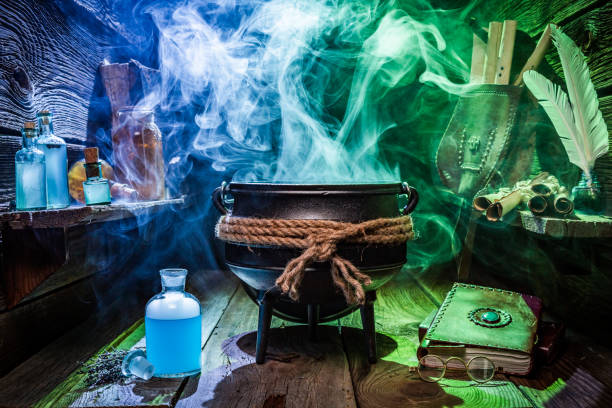 istock Witcher cauldron with magic potions and books for Halloween 1050156932