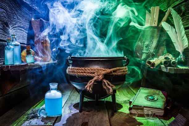 Witcher cauldron with magic potions and books for Halloween