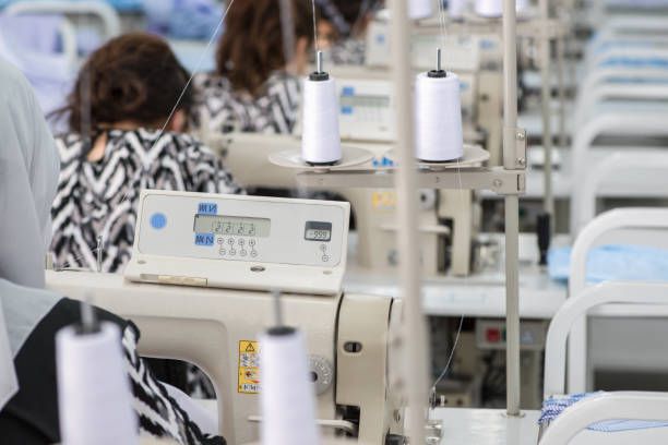 istock workshop in sewing shirts in a textile factory 1050160072