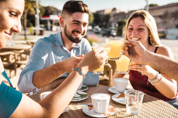 friends toasting at the cafe for a celebration