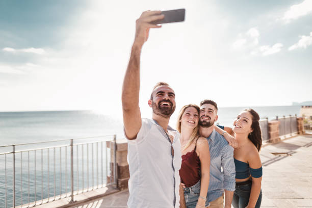 istock friends take a selfie on the street 1050162914