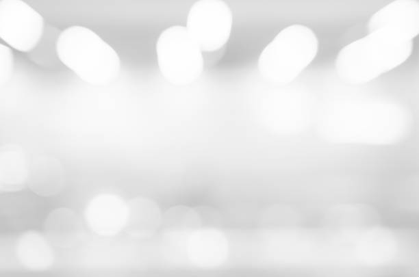 istock abstract blurry soft focus shine brighten white silver wallpaper with bokeh circle light for merry christmas and happy new year festival season background concept 1050166078