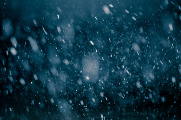 Photo of Snowfall against black background.