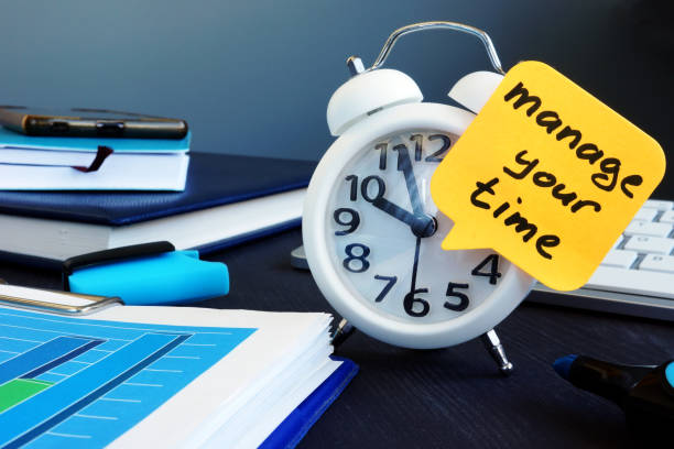 istock Manage your time. Alarm clock and memo stick. 1050184196
