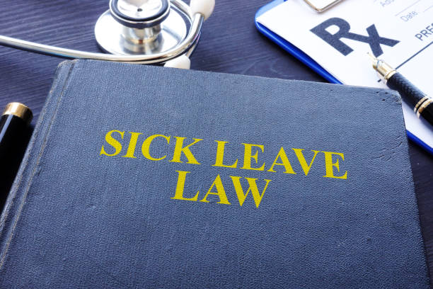 istock Sick Leave Law book and the stethoscope. 1050184272