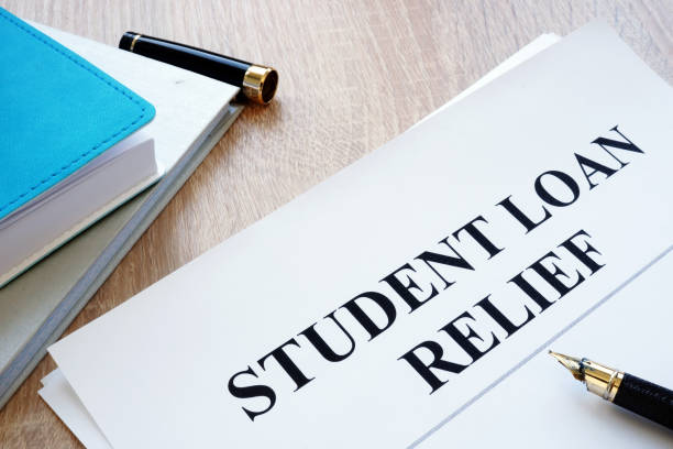istock Student loan relief papers on the desk. 1050186614