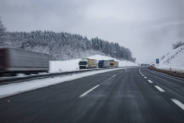 istock Trucks Driving on Icy Highway 1050186862