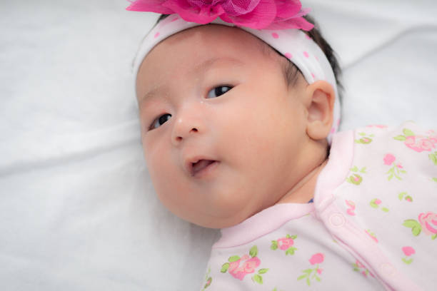 istock Newborn baby sleeping 4 weeks old in pink 1050186910