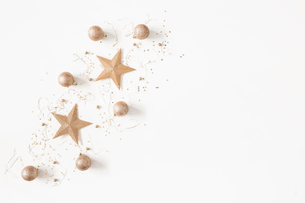 istock Christmas composition. Christmas golden decorations on white background. Flat lay, top view, copy space 1050187654