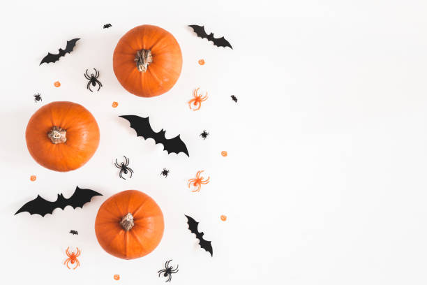 Halloween decorations on white background. Halloween concept. Flat lay, top view, copy space