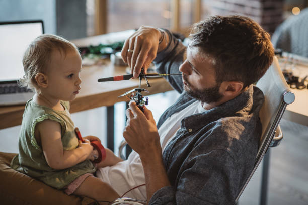 istock Daughter enjoy to help father at home 1050192700