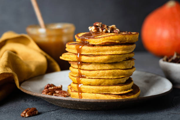 istock Pumpkin pancakes with caramel sauce and pecan nuts 1050202374