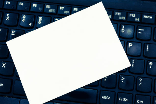 istock Design business concept Empty copy text for Web banners promotional material mock up template Blank Notepad Sheet Index Sized for Reminding Lying on Laptop keyboard 1050205330
