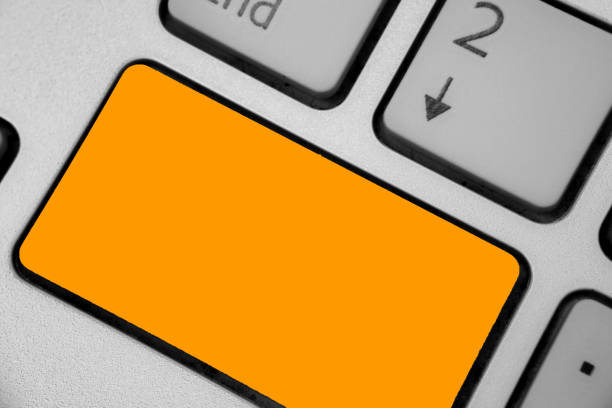 istock Business concept Empty template copy space isolated Posters coupons promotional material Keyboard orange key Intention create computer computing reflection document 1050208186