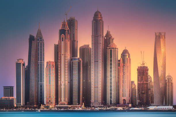 Modern buildings of Dubai Marina bay view from Palm Jumeirah during sunset, UAE. Clipping path of sky