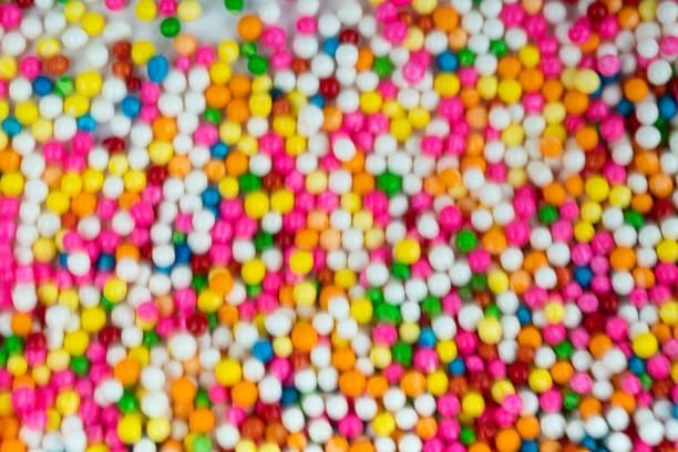colorful sugar candy balls stacked in motion