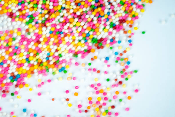 istock colorful sugar candy balls stacked in motion 1050216182