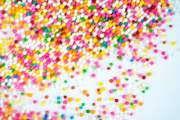 istock colorful sugar candy balls stacked in motion 1050216188