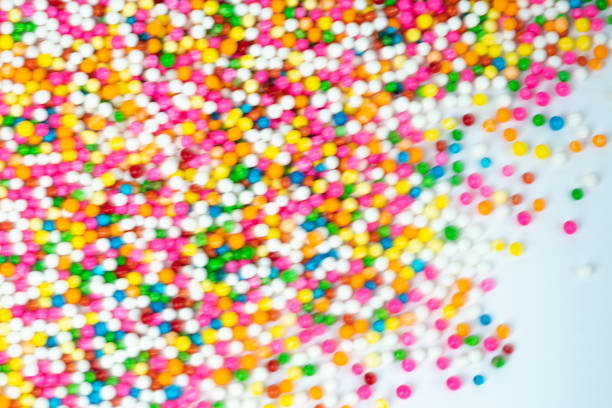 istock colorful sugar candy balls stacked in motion 1050216230