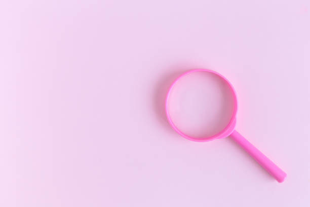 istock Magnifier on pastel background search minimalistic concept. Space for copy. 1050223050