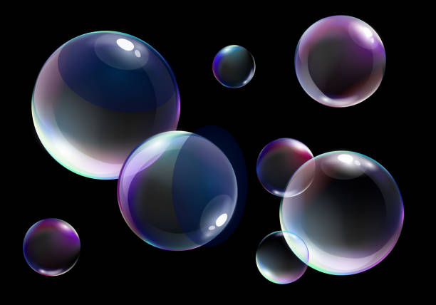 istock Vector illustration of realistic soap bubbles with bright rainbow colors on black background. 1050225484