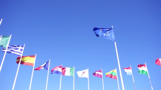 Flags of European Union countries against the blue sky