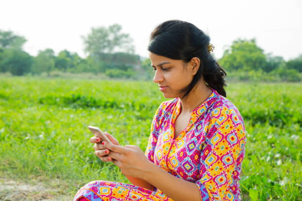 istock Girl using mobile phone - Stock images 1050235512