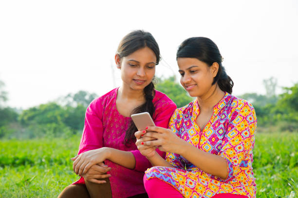 istock Sister using mobile phone - Stock images 1050235902