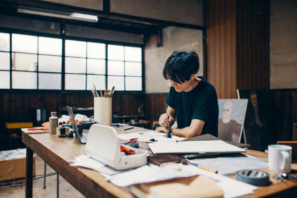 istock Mature male artist sketching ideas in his studio 1050236048