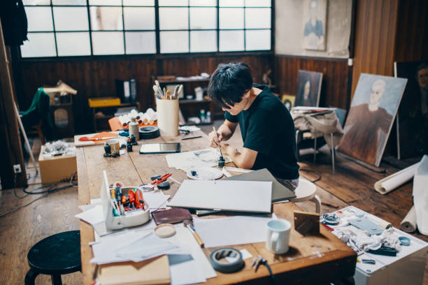 istock Mature male artist sketching ideas in his studio 1050236088
