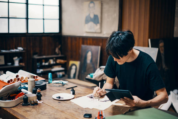 istock Mature male artist sketching ideas in his studio 1050236114