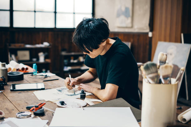 istock Mature male artist sketching ideas in his studio 1050236120