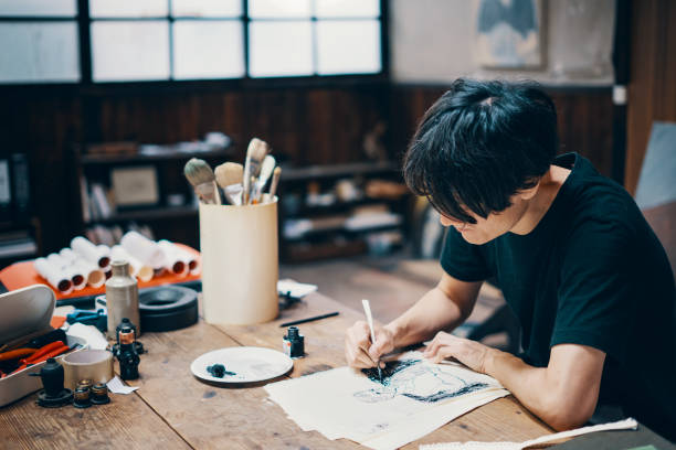 istock Mature male artist sketching ideas in his studio 1050236126
