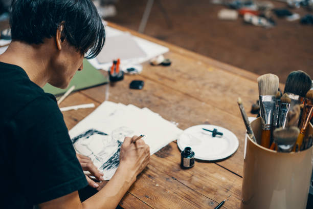 istock Mature male artist sketching ideas in his studio 1050236132