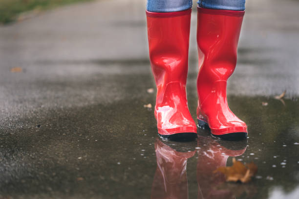 istock red rubber boots in the water 1050238618