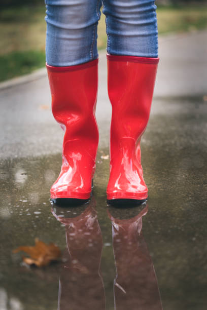 istock red rubber boots in the water 1050238996
