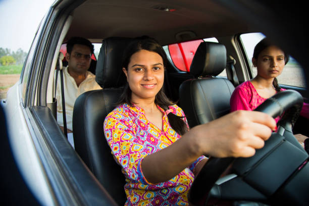 Girl learning car - Stock Images