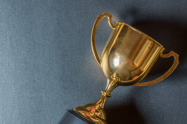 istock Golden trophy on black background 1050245220