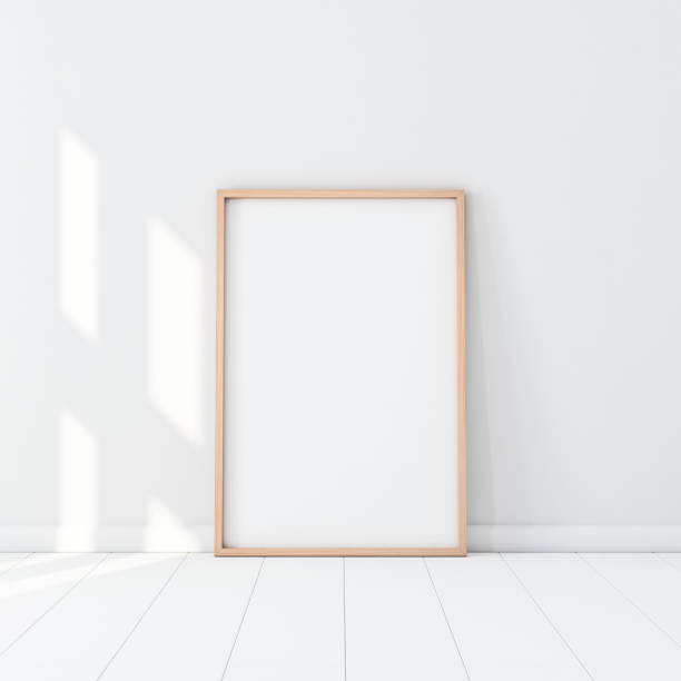 istock Wooden Frame with Poster Mockup standing on the white floor 1050245752