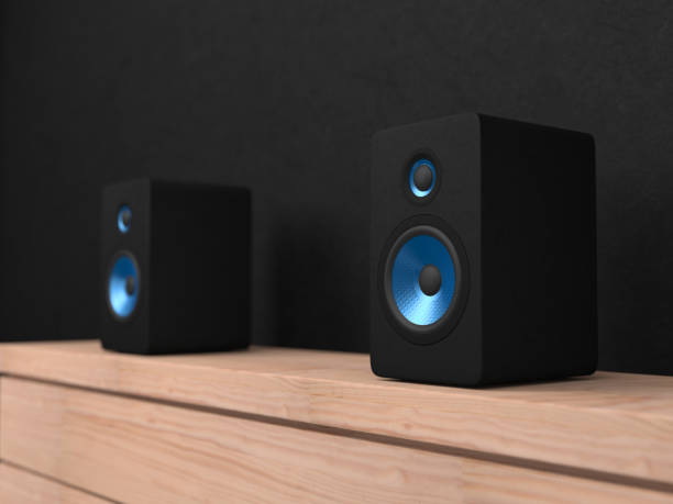 istock Black stereo Speakers with blue drivers on shelf 1050246094