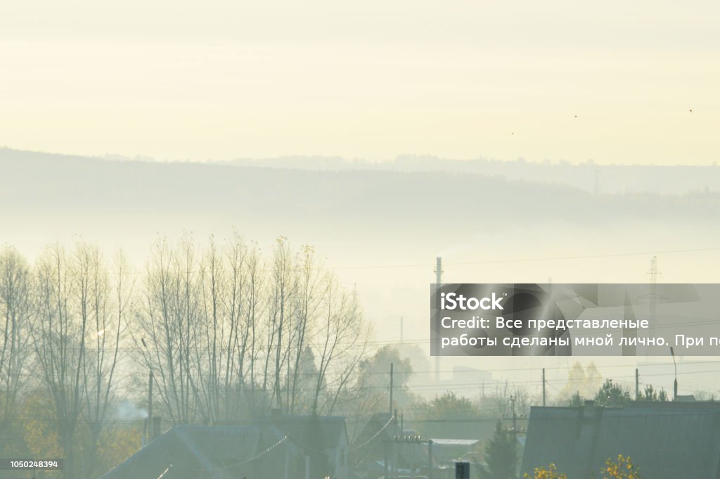 Morning in the city. Smoke in the distance outside the city Horizontal Stock Photo