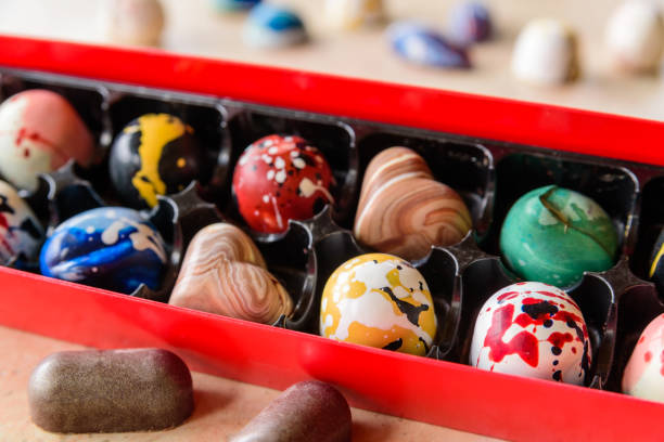 istock Open gift box with assortment of chocolate bonbons 1050251246
