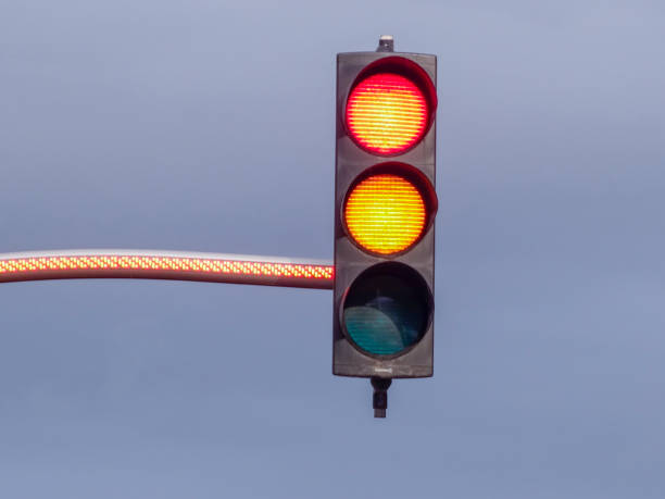 istock Green Traffic Light against Blue Sky Backgrounds 1050258252