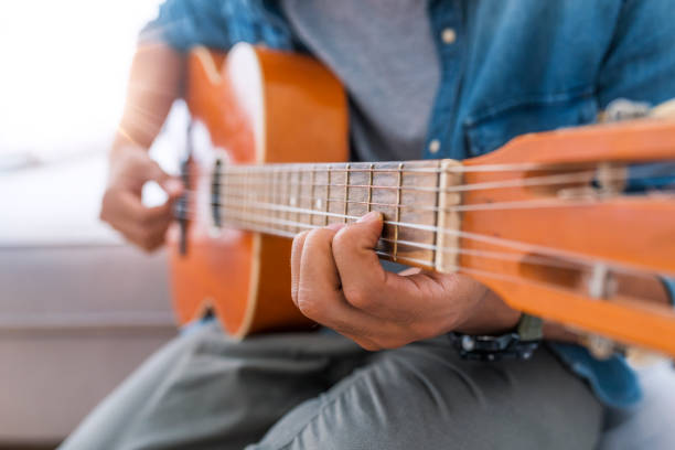 istock Man playing an acoustic guitar 1050264282