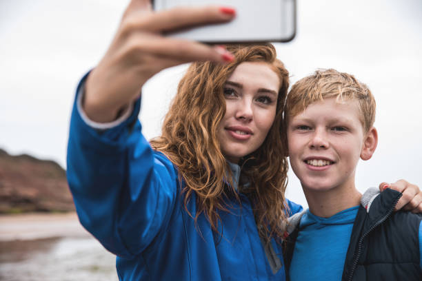 istock Brother and sister camping and hiking in Cornwall 1050267586