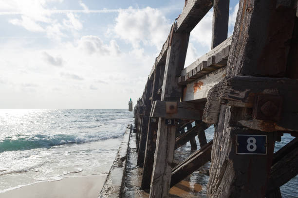 istock old dock next to the sea 1050270062