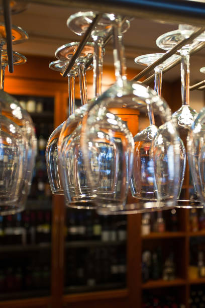 istock glasses for wine hanging above bar counter 1050277156
