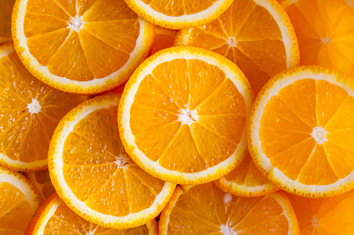 background made of sliced juicy oranges