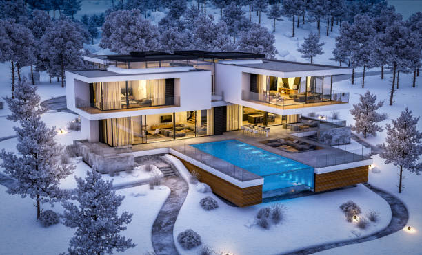 istock 3d rendering of modern house by the river in winter night 1050277462