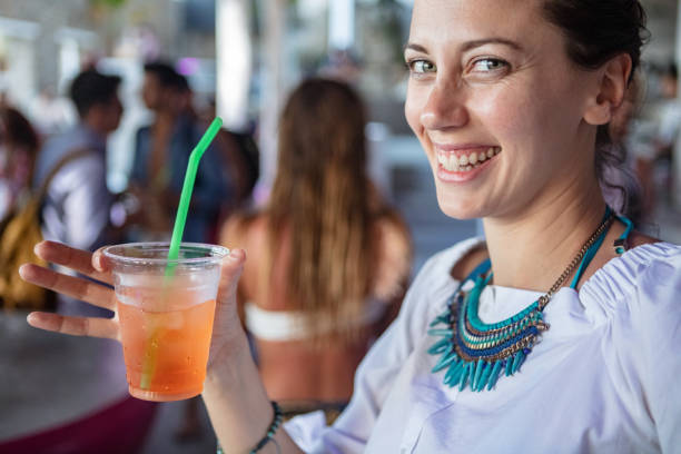 Beautiful woman enjoying cocktail in bar